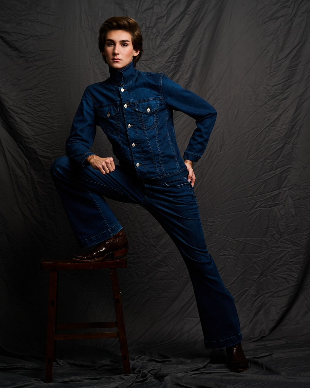 Austin in a denim jacket and flared jeans