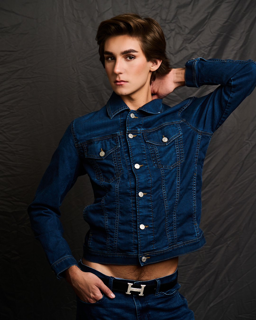 Austin in a denim jacket and flared jeans