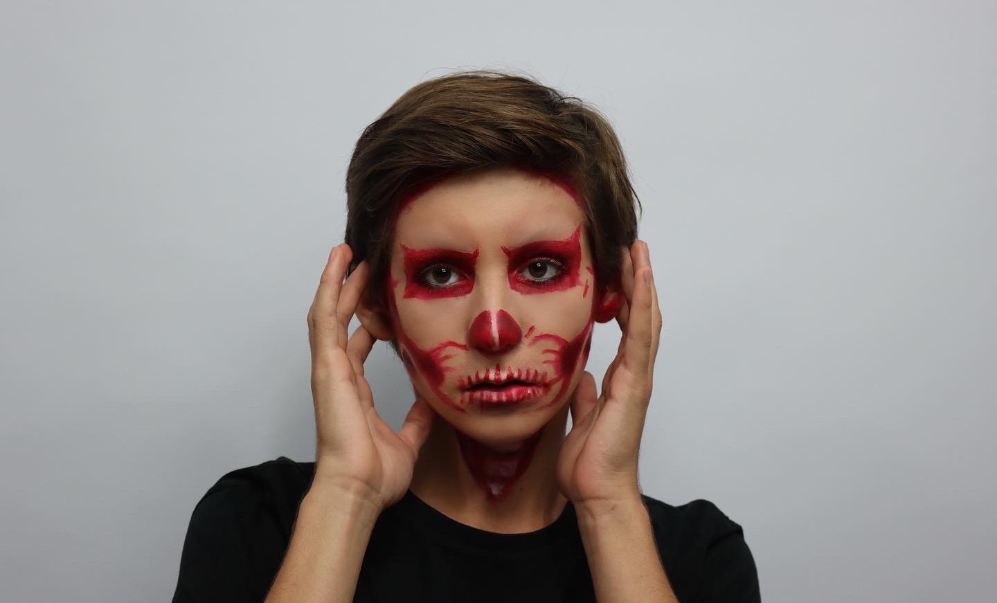 Red line-work skull face
