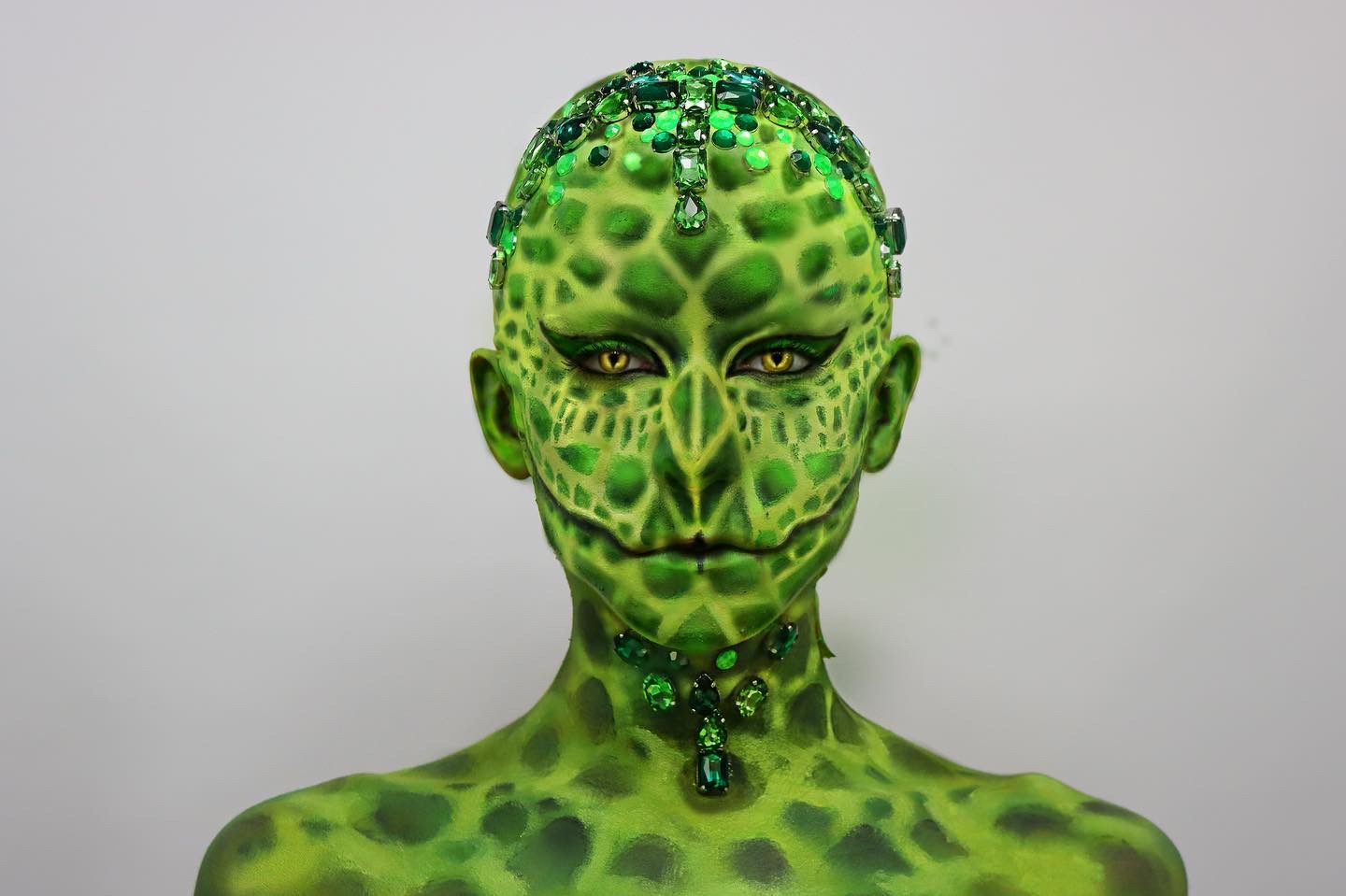 Green reptile body paint with gems